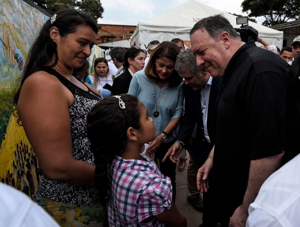 PHOTO: Secretary of State Mike Pompeo, accompanied by Colombian President Ivan Duque, talks with Venezuelan refugees during a visit to the Transitional Attention for the Migrant Office in Cucuta, Norte del Santander Department, Colombia, April 14, 2019.