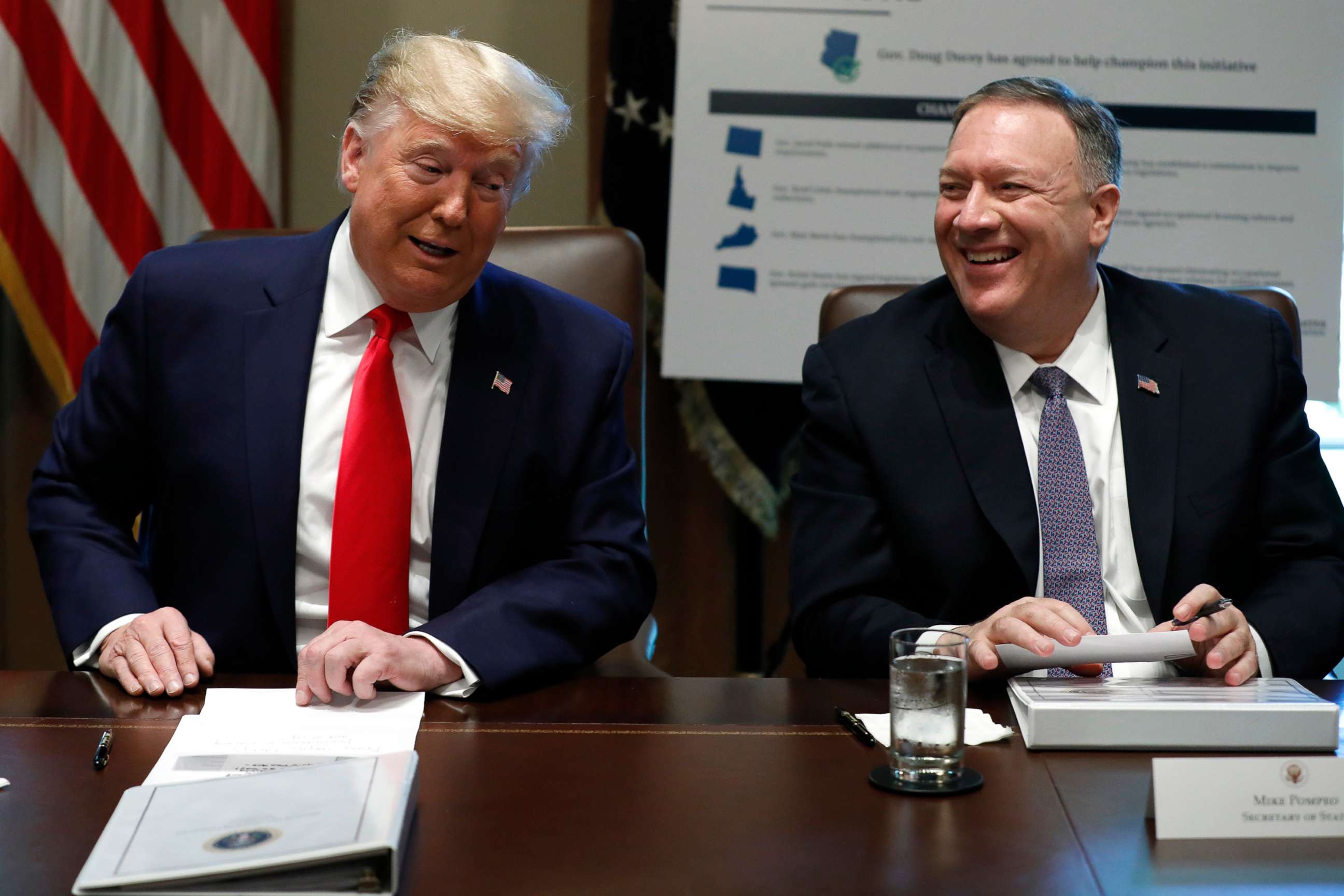 PHOTO: President Donald Trump and Secretary of State Mike Pompeo laugh during a Cabinet Meeting at the White House, Oct. 21, 2019.