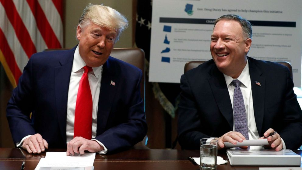 President Donald Trump and Secretary of State Mike Pompeo laugh during a Cabinet Meeting at the White House, Oct. 21, 2019.