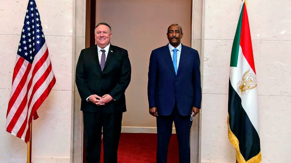 PHOTO: Secretary of State Mike Pompeo stands with Sudanese Gen. Abdel-Fattah Burhan, the head of the ruling sovereign council, in Khartoum, Sudan, Aug. 25, 2020.