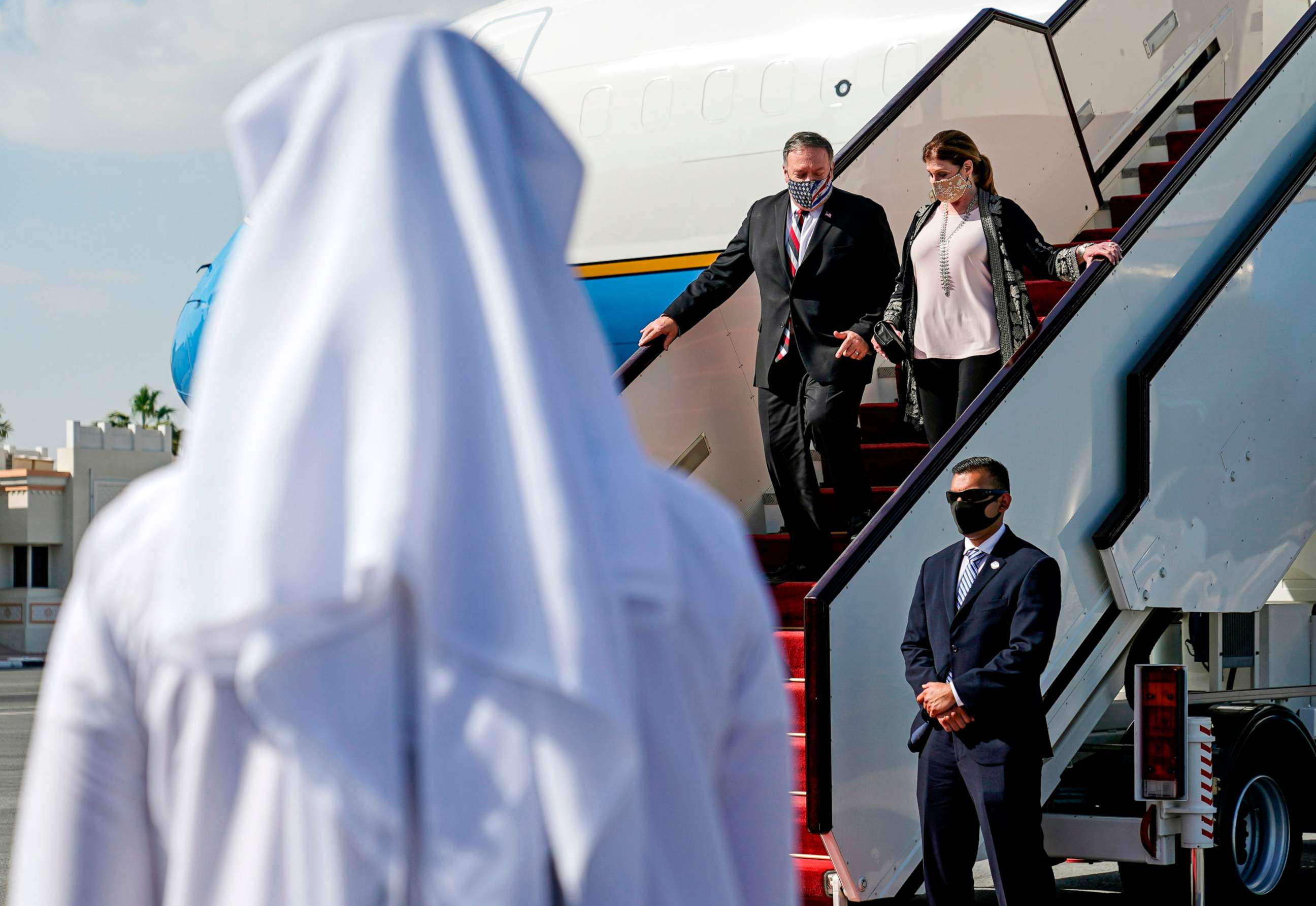 PHOTO: Secretary of State Mike Pompeo and his wife Susan step off a plane upon arrival at Old Doha International Airport in Qatar's capital on Nov. 21, 2020.