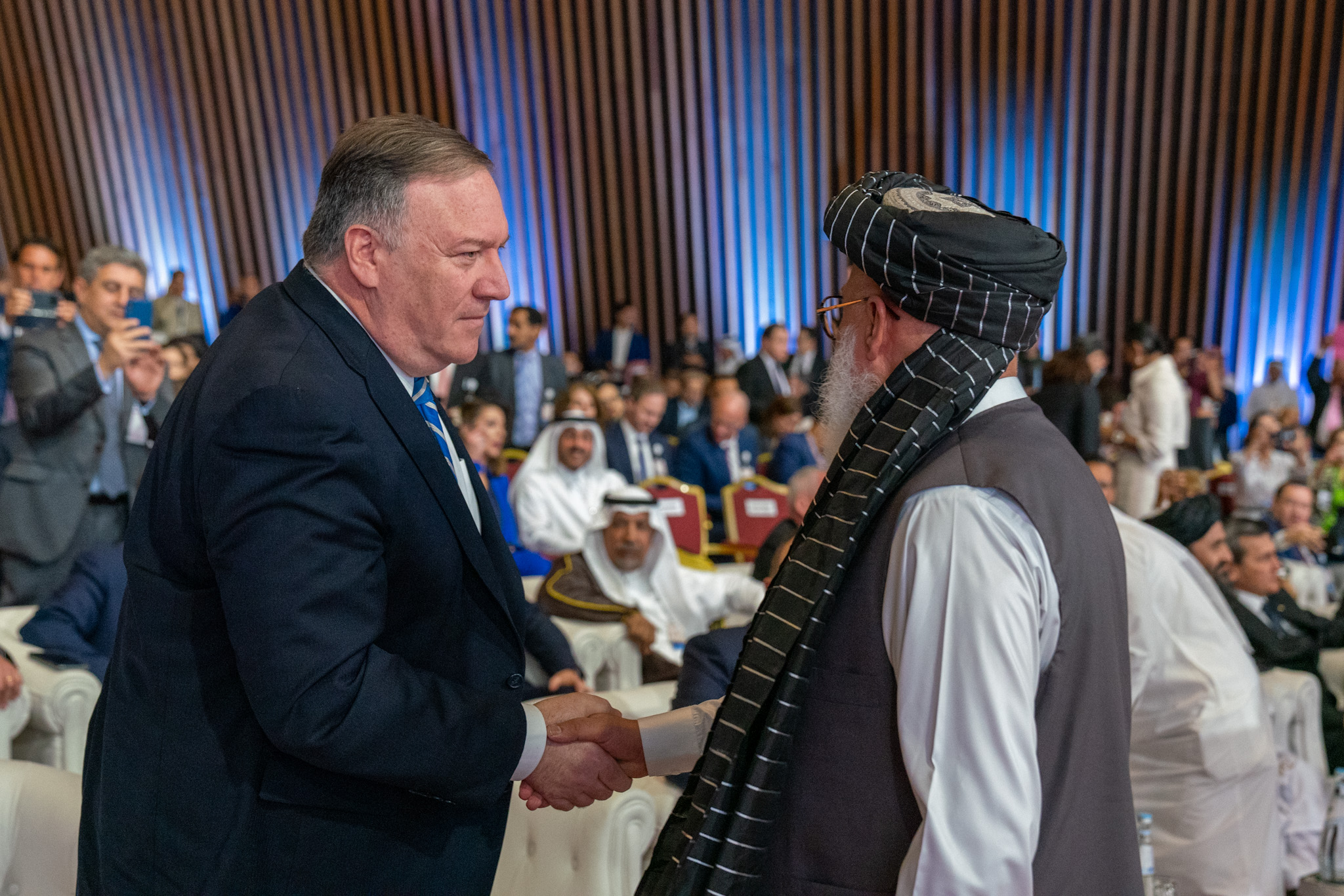 PHOTO: Secretary of State Mike Pompeo shakes hands with Taliban negotiator Sher Mohammad Abbas Stanikzai during a signing ceremony in Doha, Qatar, Feb. 29, 2020.