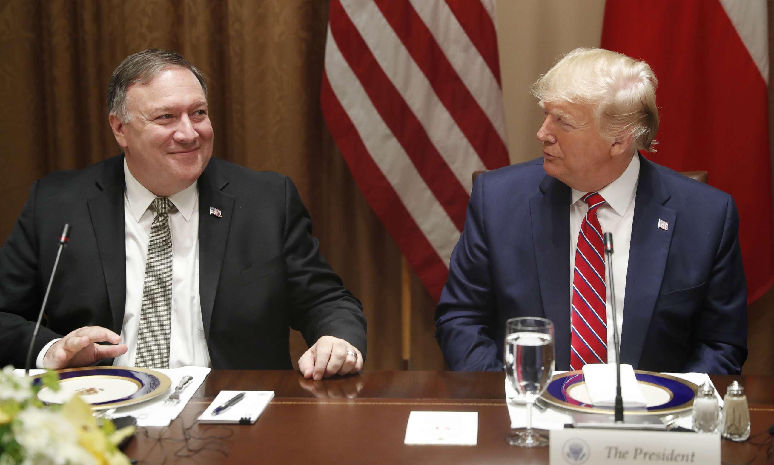 PHOTO: President Donald Trump, right, speaks with Mike Pompeo, U.S. secretary of state, left, during a luncheon at the White House in Washington, D.C. on June 12, 2019.