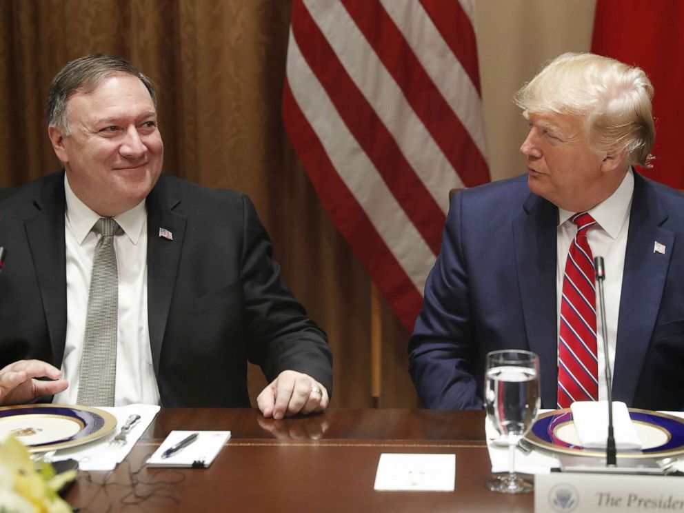 PHOTO: President Donald Trump, right, speaks with Mike Pompeo, U.S. secretary of state, left, during a luncheon at the White House in Washington, D.C. on June 12, 2019.
