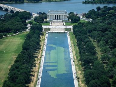 Murky Reflecting Pool draws tourists, but not for reasons Trump wanted