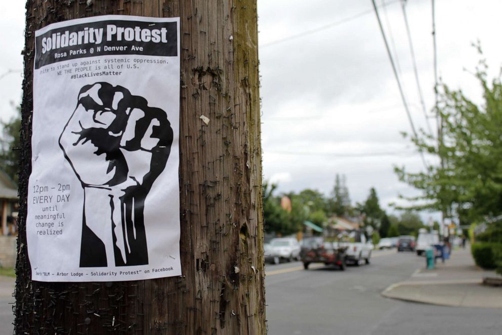 PHOTO: A sign advertising a daily protest in solidarity with Black Lives Matter is affixed to a telephone pole in a historically Black neighborhood in Portland, Ore., on Wednesday, July 1 2020.
