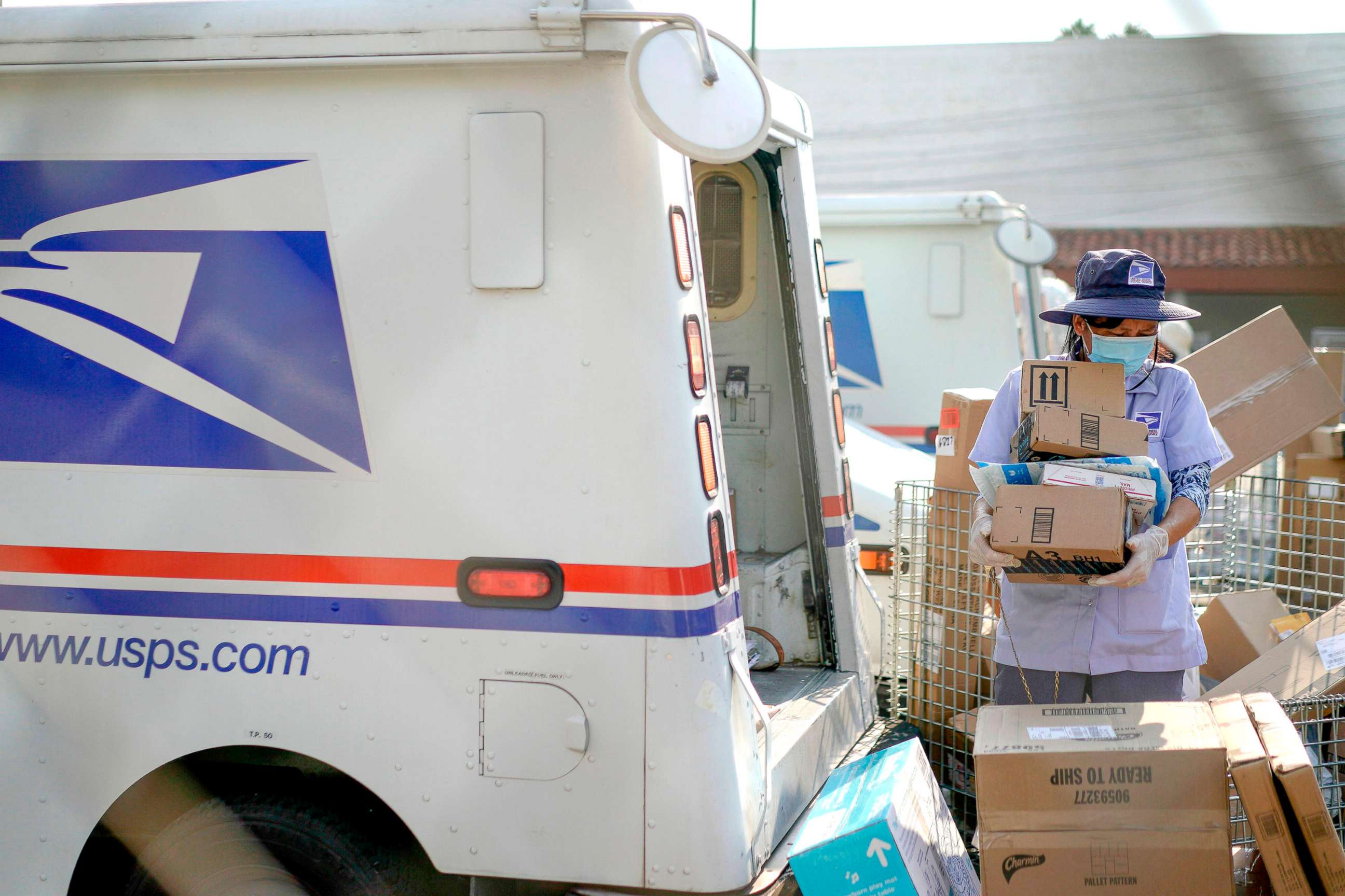 PHOTO: Postal workers sort, load and deliver mail in Los Angeles, Calif., Aug. 22, 2020. 