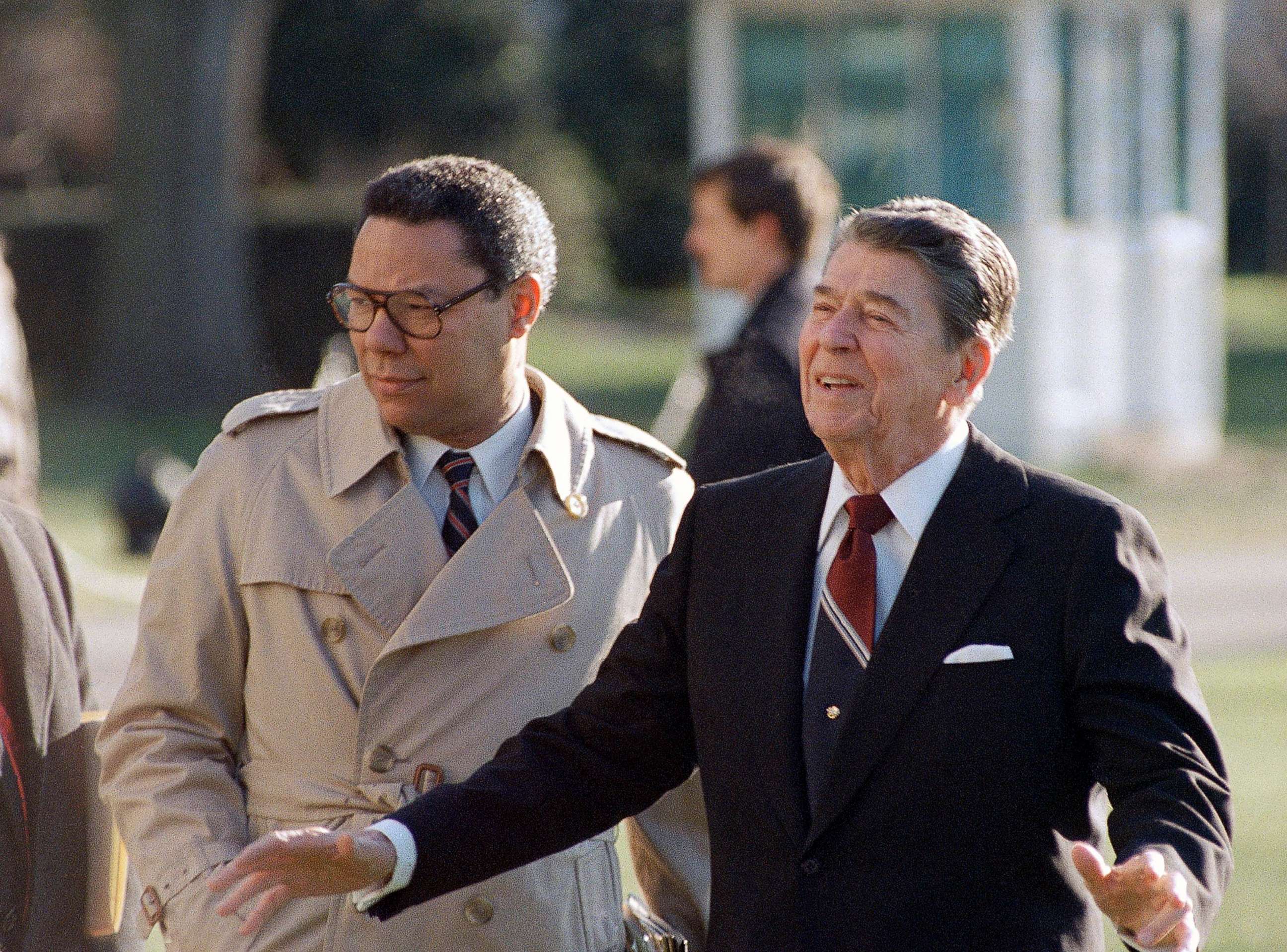 PHOTO: President Ronald Reagan, accompanied by national security adviser Colin Powell, leaves the White House, Dec. 16, 1988.