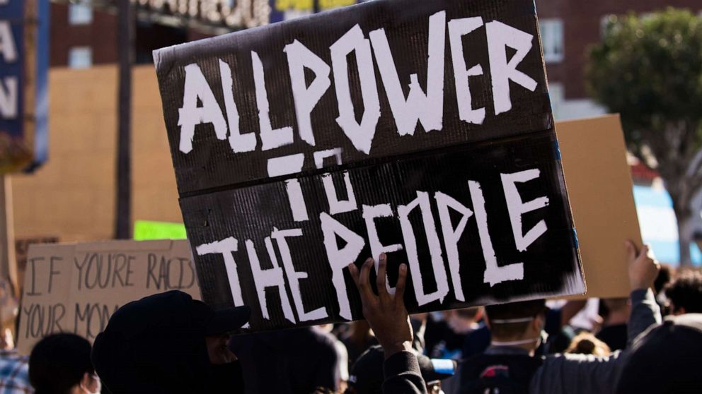 PHOTO: A protester holds up a sign during the YG x BLMLA x BLDPWR protest and march on June 07, 2020, in Los Angeles.