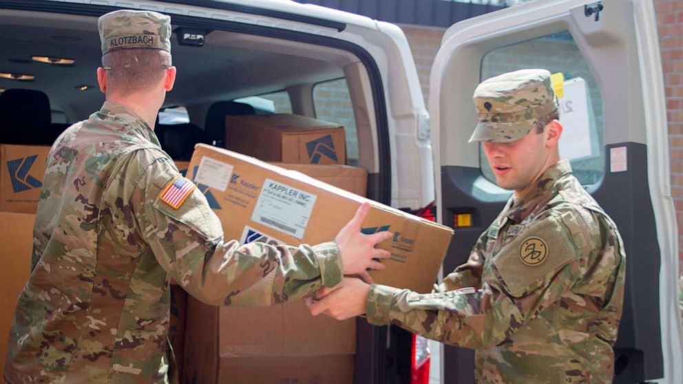 PHOTO: Pfc. Joshua Klotzbach and Spc. Nicholas Woodward load medical supplies and personal protective equipment in Syracuse, New York for shipment for New York City, April 6, 2020.