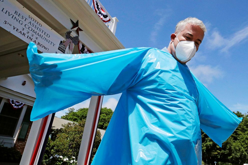 PHOTO: Brendan Williams wears an isolation gown with no sleeve openings for hands, which was received in a shipment from the federal government, outside Webster at Rye senior care center, July 1, 2020, in Rye, N. H.