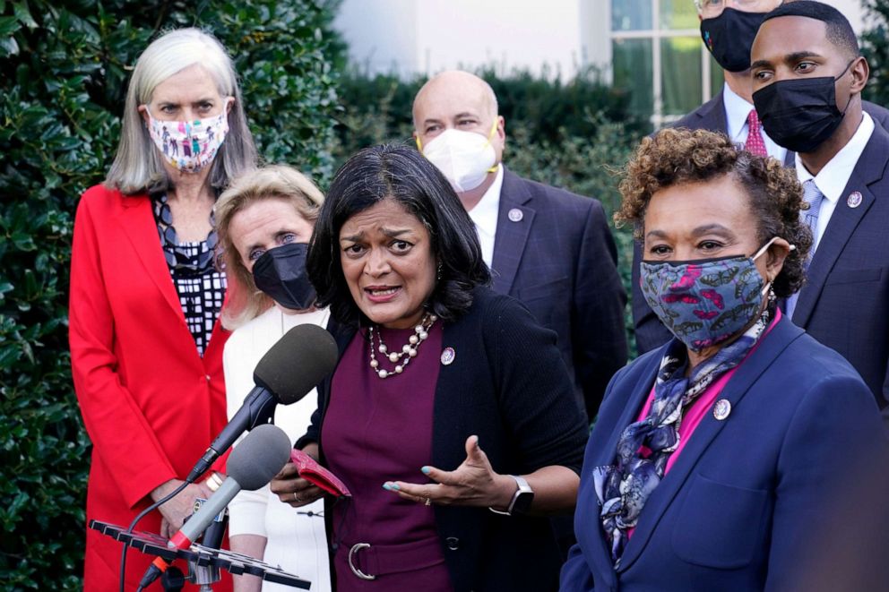 PHOTO: Rep. Pramila Jayapal, the chair of the Congressional Progressive Caucus, center, along with other lawmakers, talks with reporters outside the West Wing of the Washington, Oct. 19, 2021, following their meeting with President Joe Biden.