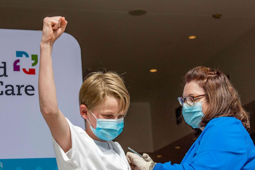 PHOTO: Charles Muro,13, celebrates being inoculated by Nurse Karen Pagliaro in Hartford, Connecticut, May 13, 2021.