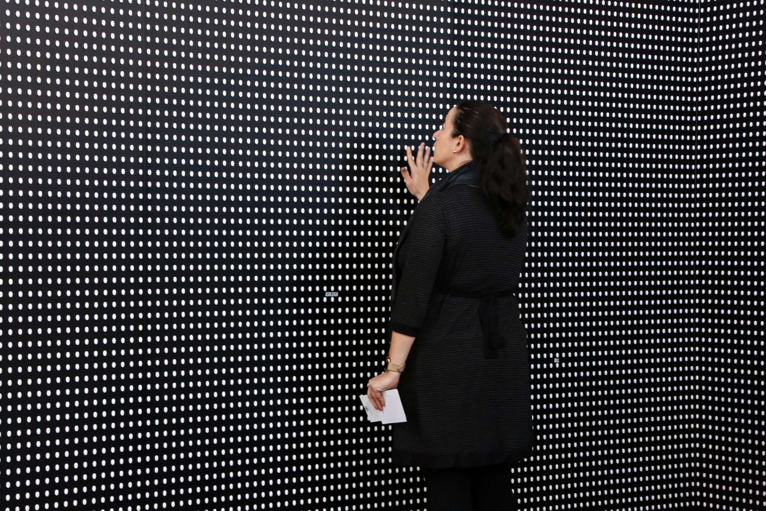 PHOTO: Janine Fisher of Pittsburgh looks at an art installation called "Prescribed to Death Memorial" at the William Pitt Union at the University of Pittsburgh, Jan. 31, 2018 in Pittsburgh. 