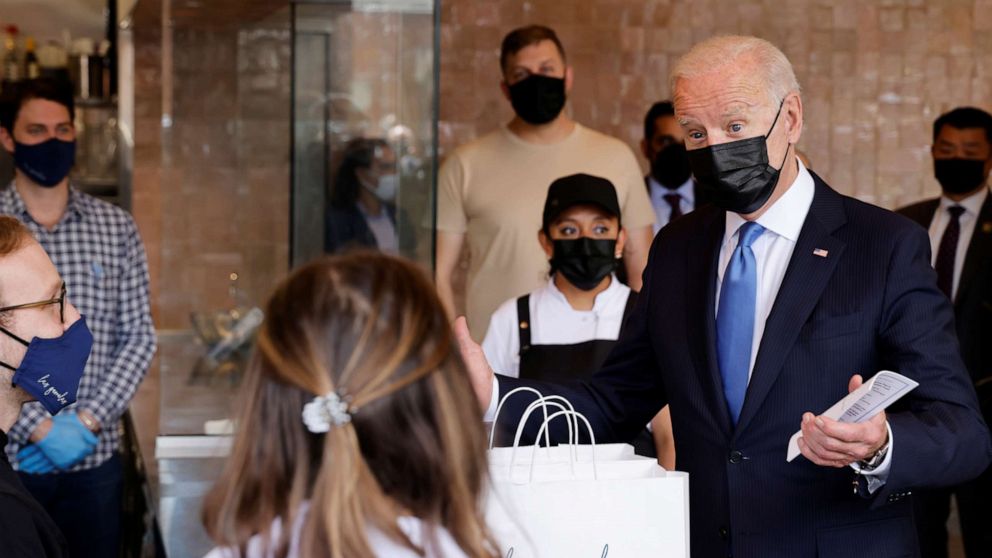 PHOTO: President Joe Biden speaks with the staff as he visits the Las Gemelas Taqueria restaurant for carry-out lunch on Cinco de Mayo in the Union Market neighborhood in Washington, May 5, 2021.