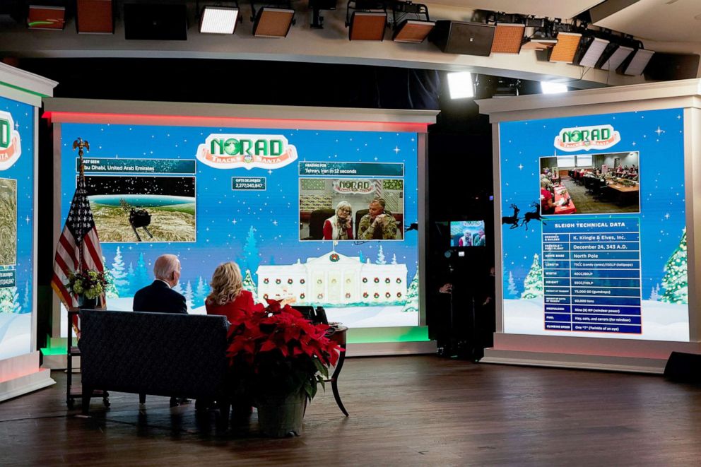 PHOTO: President Joe Biden and first lady Jill Biden participate in NORAD Santa tracker phone calls from South Court Auditorium at the White House in Washington, Dec. 24, 2021.