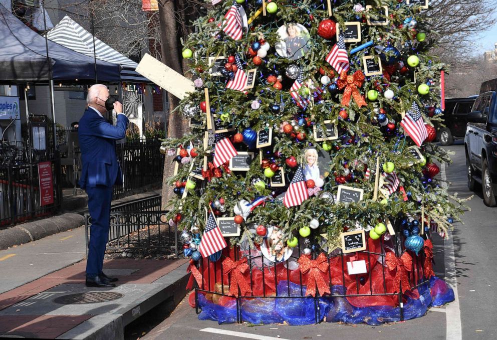 PHOTO: President Joe Biden visits the Christmas Tree in honor of First Lady Jill Biden outside Floriana Italian Restaurant in Washington, DC, Dec. 24, 2021.