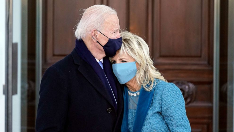 PHOTO: President Joe Biden and first lady Jill Biden hug as they arrive at the North Portico of the White House, Jan. 20, 2021, in Washington.
