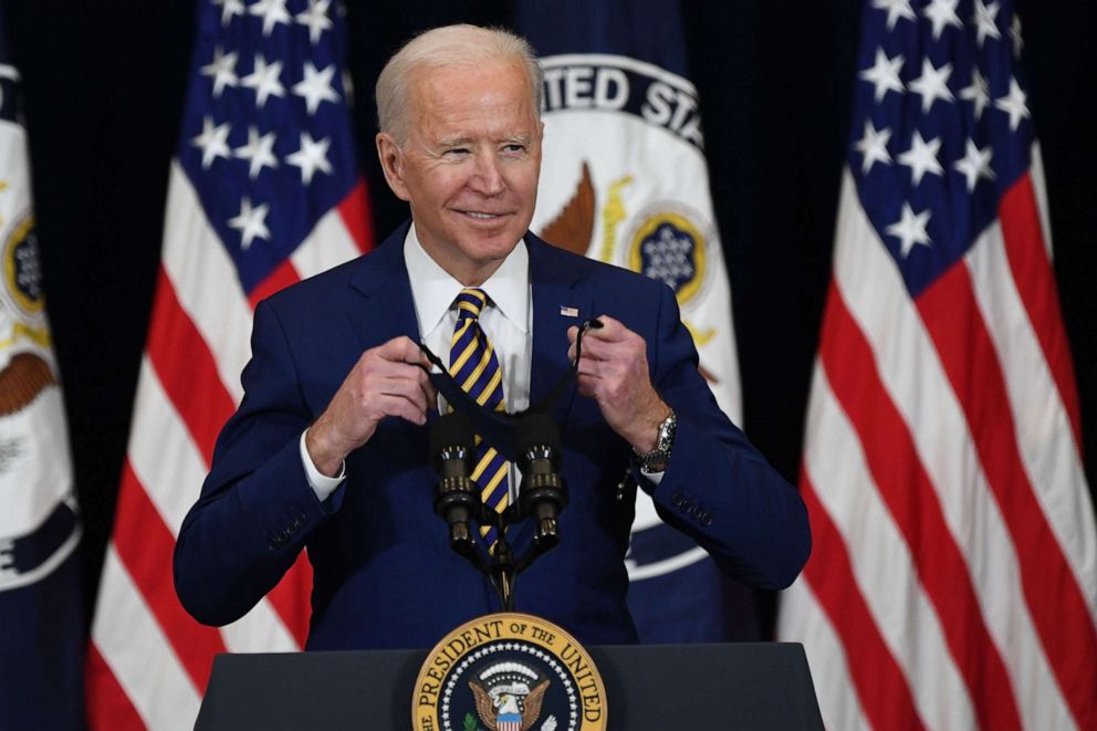 PHOTO: President Joe Biden takes hi smask off before speaking to staff of the US State Department during his first visit in Washington, D.C, Feb. 4, 2021.