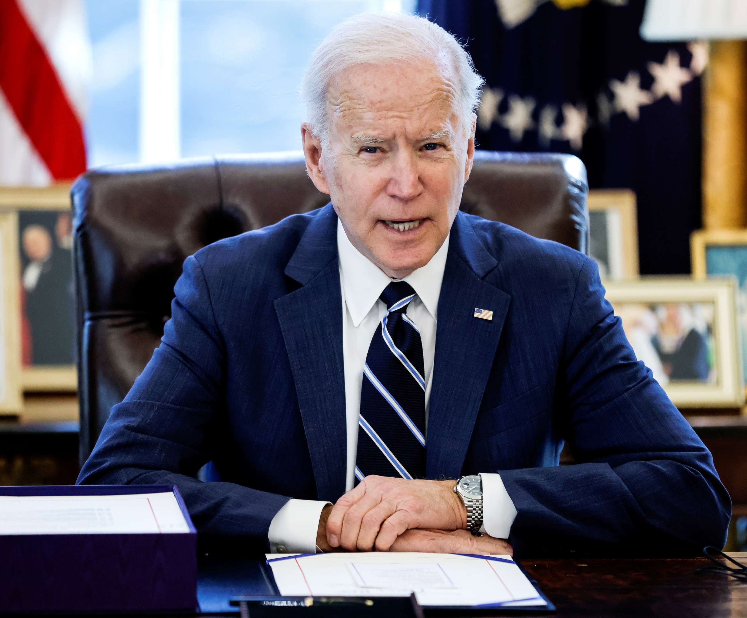 PHOTO: President Joe Biden speaks prior to signing the "American Rescue Plan," a package of economic relief measures to respond to the impact of the pandemic, inside the Oval Office at the White House, March 11, 2021.