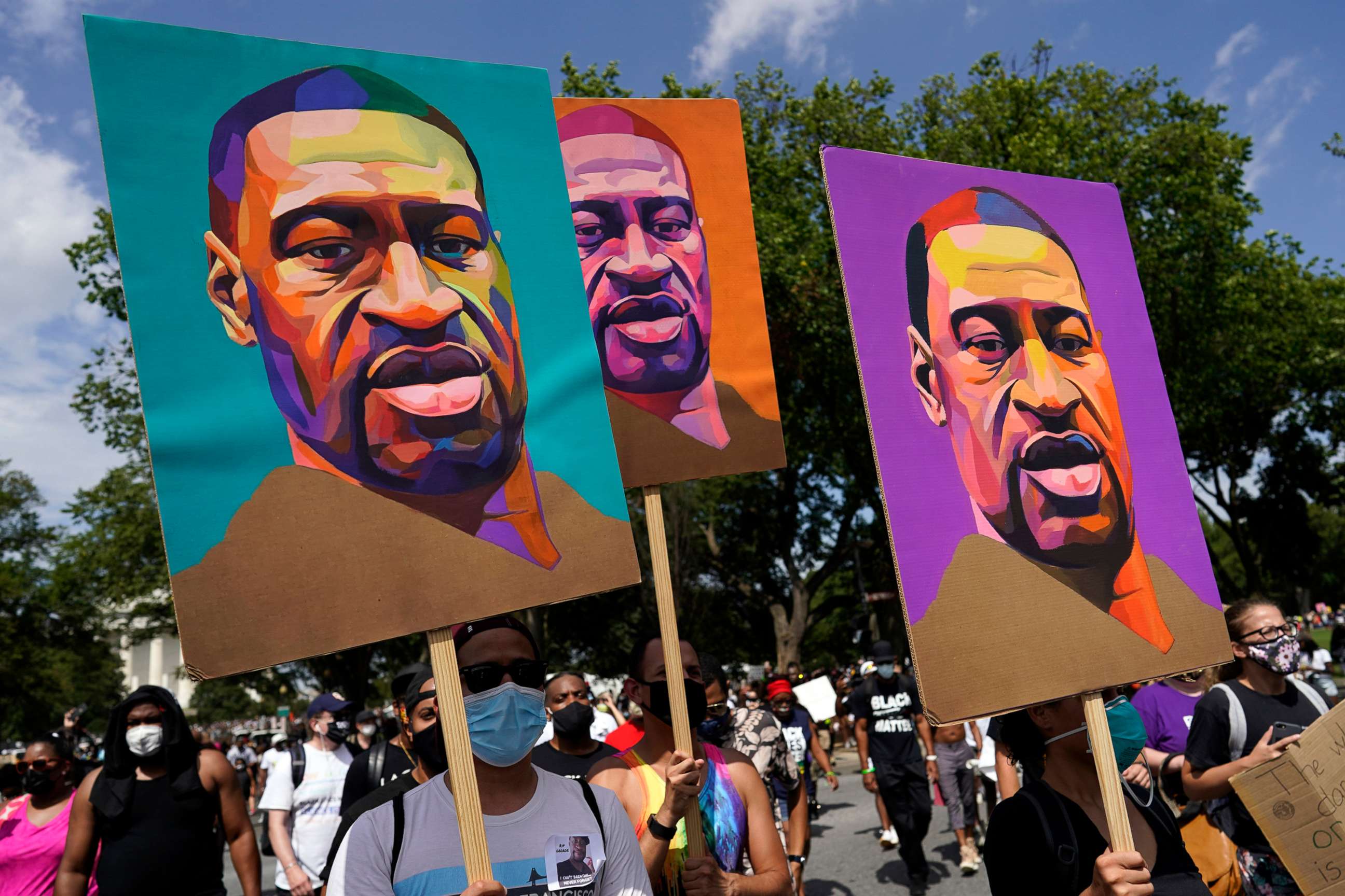 PHOTO: Images of George Floyd are carried during a  march from the Lincoln Memorial to the Martin Luther King Jr. Memorial in Washington, Aug. 28, 2020.