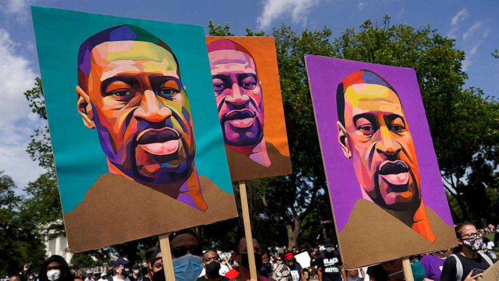 PHOTO: Images of George Floyd are carried during a  march from the Lincoln Memorial to the Martin Luther King Jr. Memorial in Washington, Aug. 28, 2020.