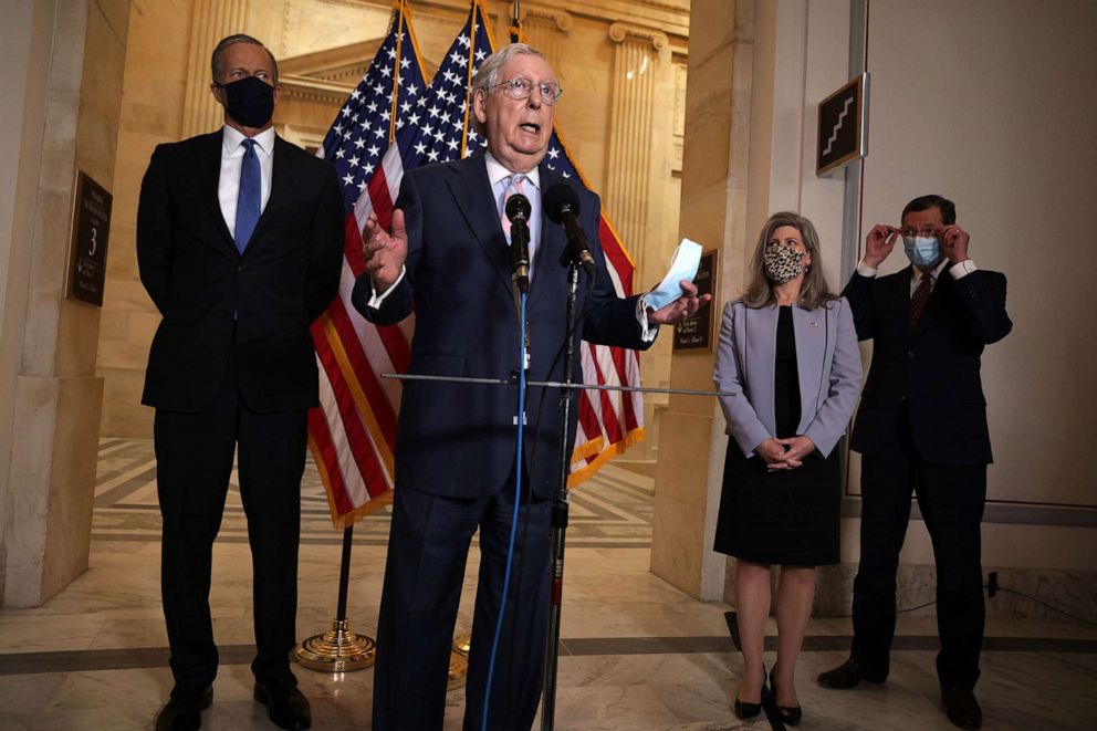 PHOTO: Senate Minority Leader Sen. Mitch McConnell speaks as  Sen. John Thune, Sen. Joni Ernst and Sen. John Barrasso listen during a news briefing after the weekly Senate Republican Policy Luncheon on Capitol Hill April 27, 2021.