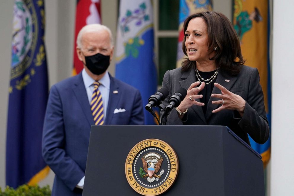 PHOTO: President Joe Biden listens as Vice President Kamala Harris speaks about the American Rescue Plan, a coronavirus relief package, in the Rose Garden of the White House, March 12, 2021.