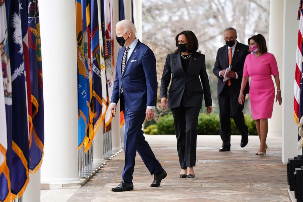 PHOTO: President Joe Biden, Vice President Kamala Harris, Senate Majority Leader Chuck Schumer, and U.S. House Speaker Nancy Pelosi, wear protective masks while arriving to an event in the Rose Garden of the White House, March 12, 2021.