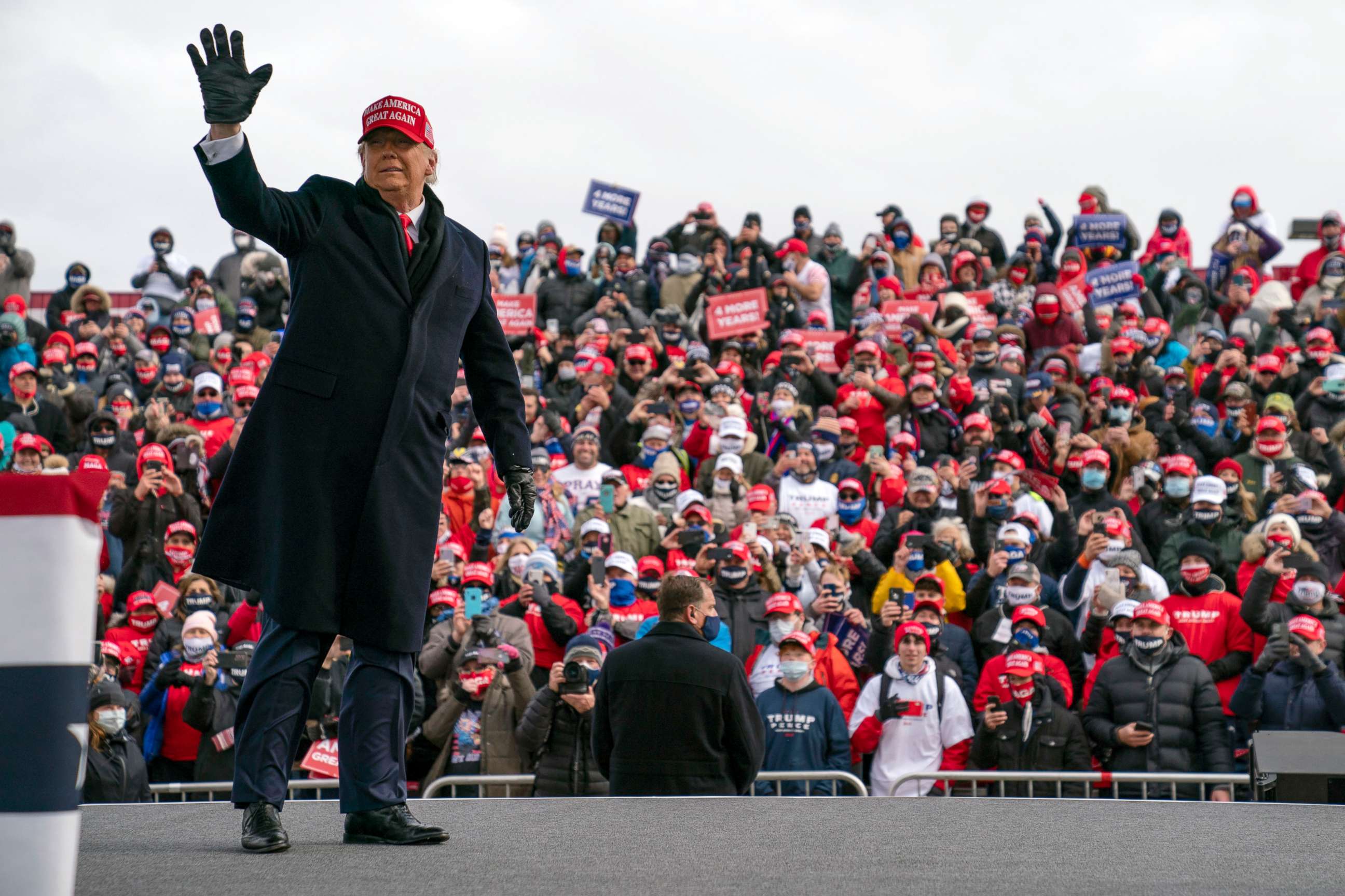 PHOTO: President Donald Trump waves as he walks off stage after speaking during a campaign rally at Michigan Sports Stars Park, Nov. 1, 2020, in Washington, Mich.