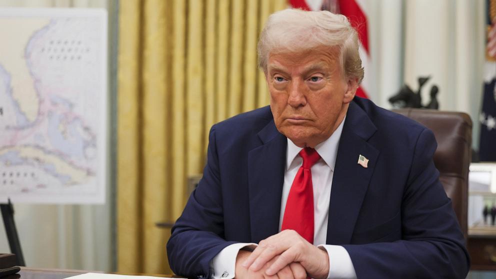 PHOTO: President Donald Trump listens to a question from a reporter before signing an executive order in the Oval Office of the White House in Washington, March 31, 2025.