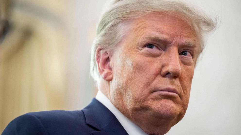 PHOTO: President Donald Trump looks on during a ceremony presenting the Presidential Medal of Freedom to wrestler Dan Gable at the White House, Dec. 7, 2020.
