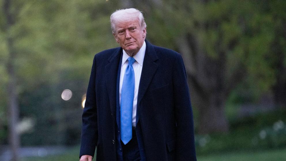 PHOTO: President Donald Trump walks on the South Lawn of the White House upon arrival in Washington, DC, April 6, 2025.