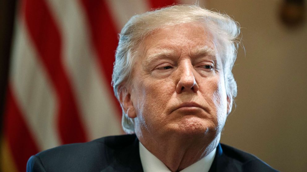 President Donald Trump listens during a meeting with lawmakers on immigration policy in the Cabinet Room of the White House in Washington. 