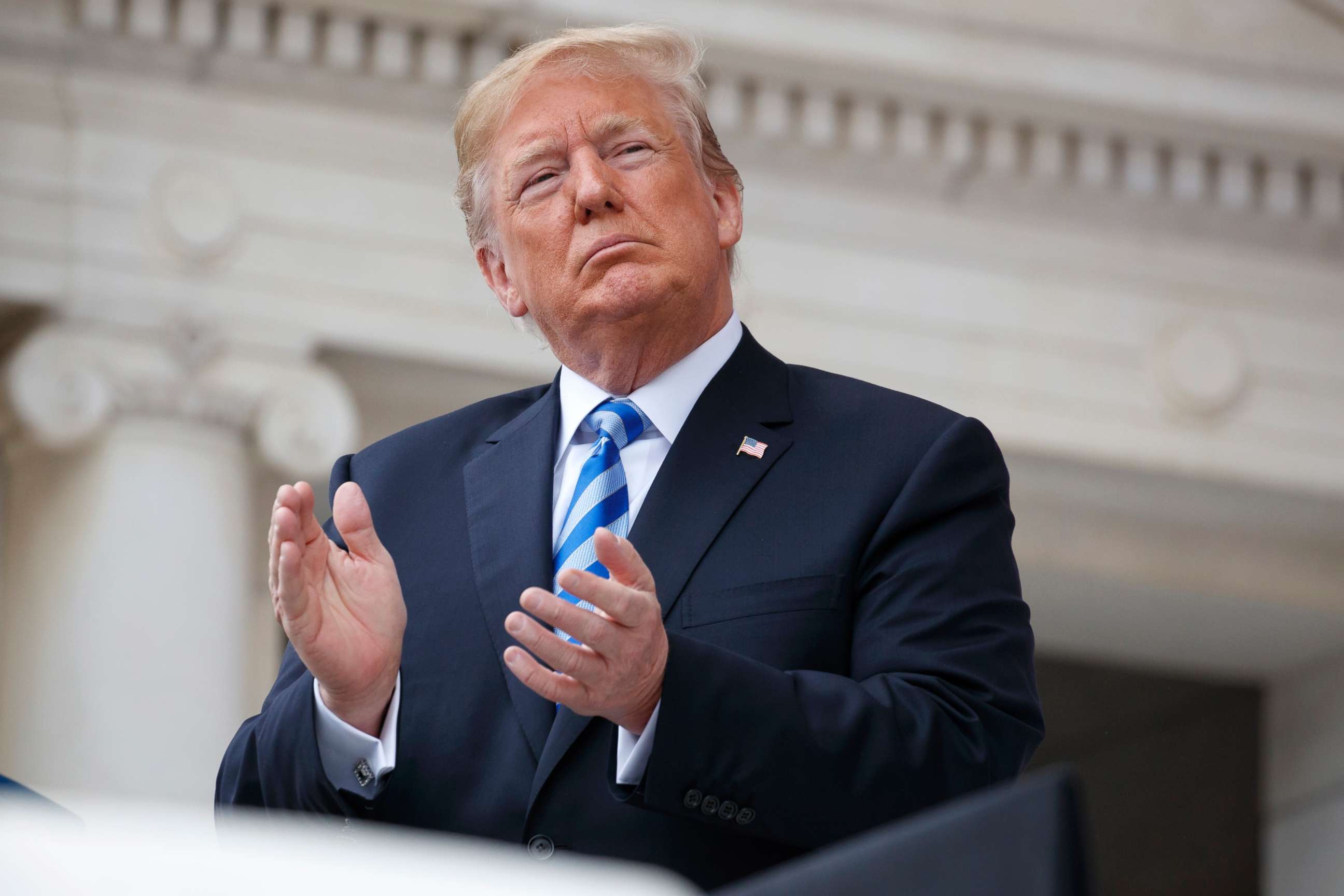 PHOTO: President Donald Trump applauds during a Memorial Day ceremony at Arlington National Cemetery, May 28, 2018, in Arlington, Va.