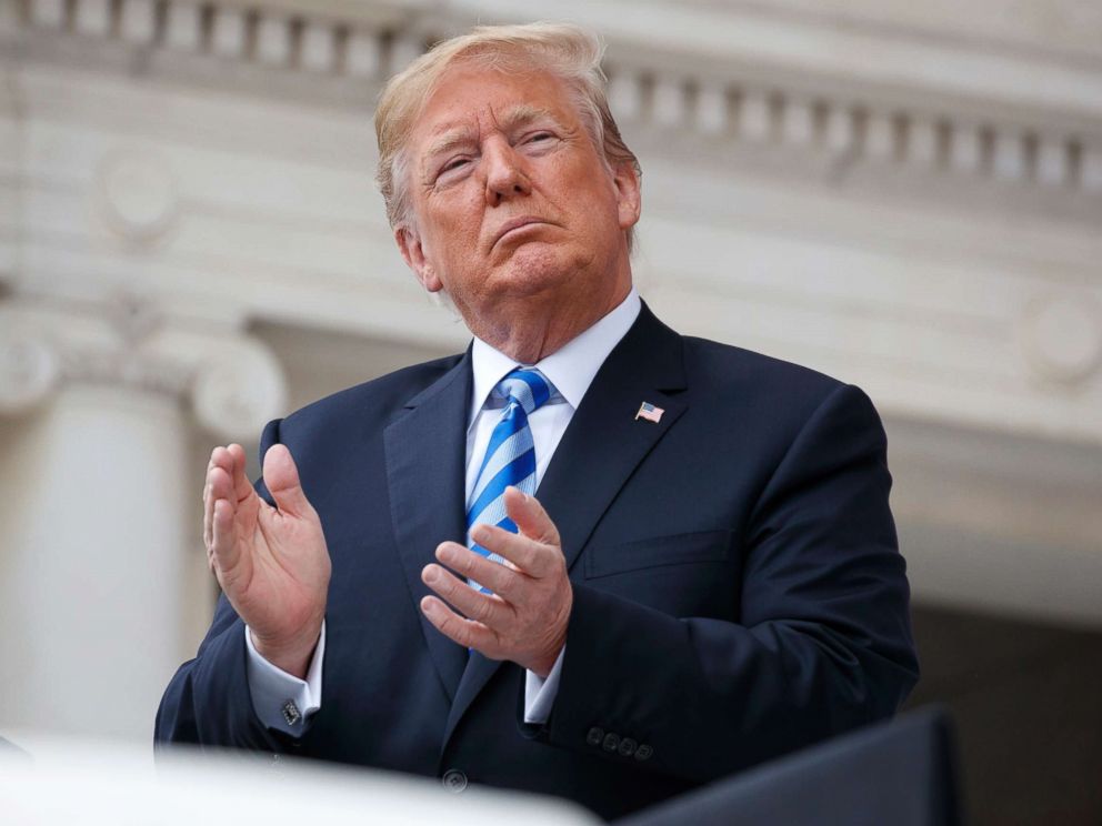 PHOTO: President Donald Trump applauds during a Memorial Day ceremony at Arlington National Cemetery, May 28, 2018, in Arlington, Va.