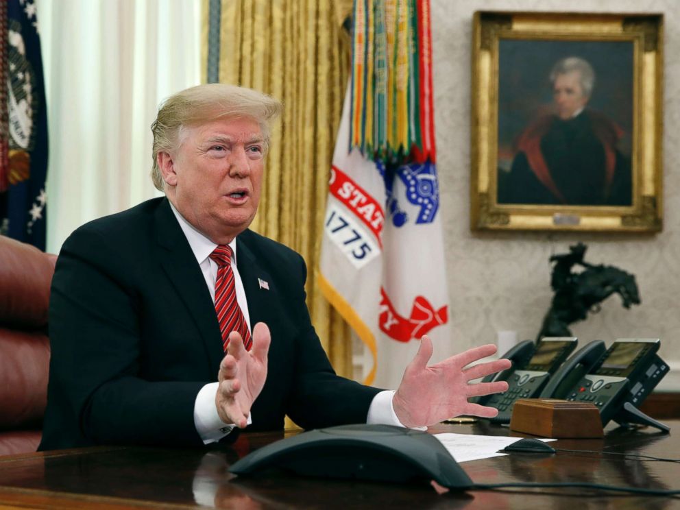 PHOTO: President Donald Trump greets members of the five branches of the military by video conference on Christmas Day, Dec. 25, 2018, in the Oval Office of the White House.