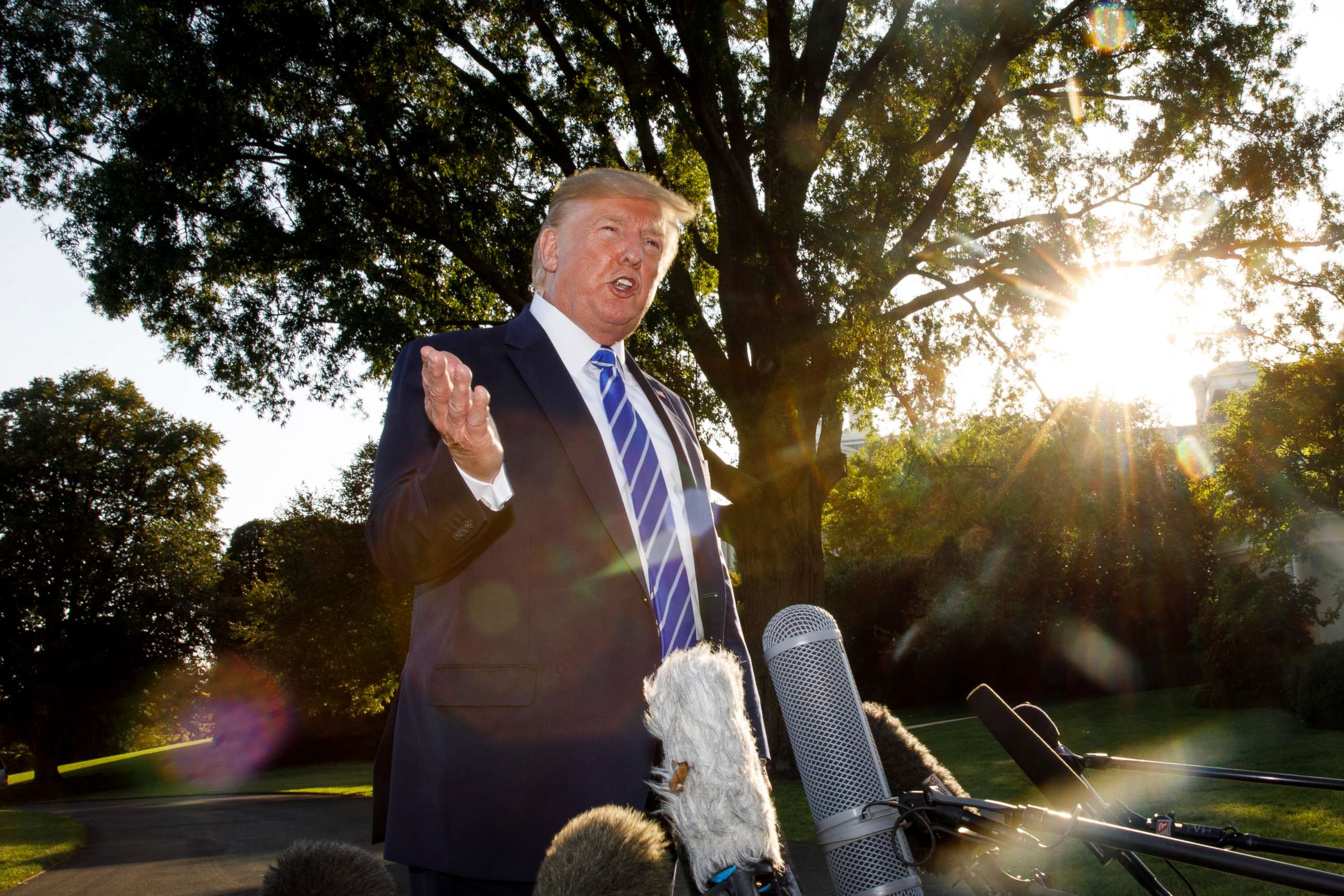 PHOTO: President Donald Trump talks to media before boarding Maine One at the White House in Washington, Aug. 30, 2019, en route to Camp David in Maryland.