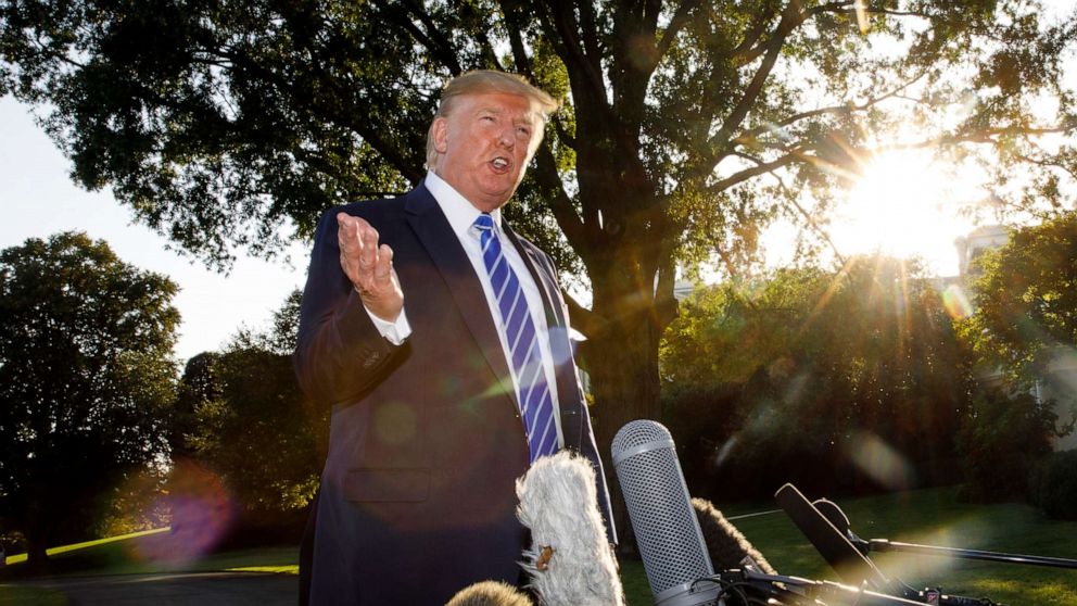 PHOTO: President Donald Trump talks to media before boarding Maine One at the White House in Washington, Aug. 30, 2019, en route to Camp David in Maryland.