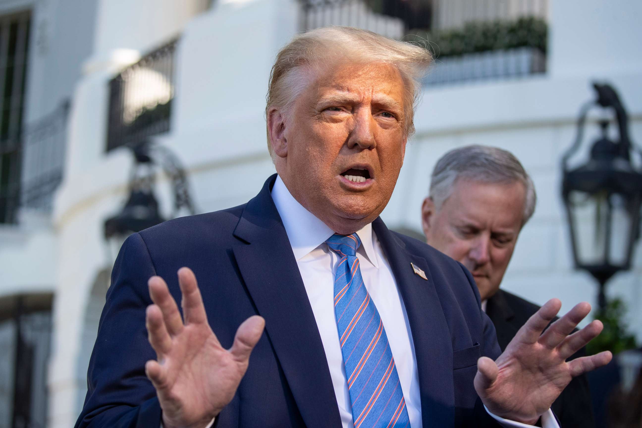 PHOTO: President Donald Trump speaks with reporters as he walks to Marine One on the South Lawn of the White House, July 29, 2020, in Washington.