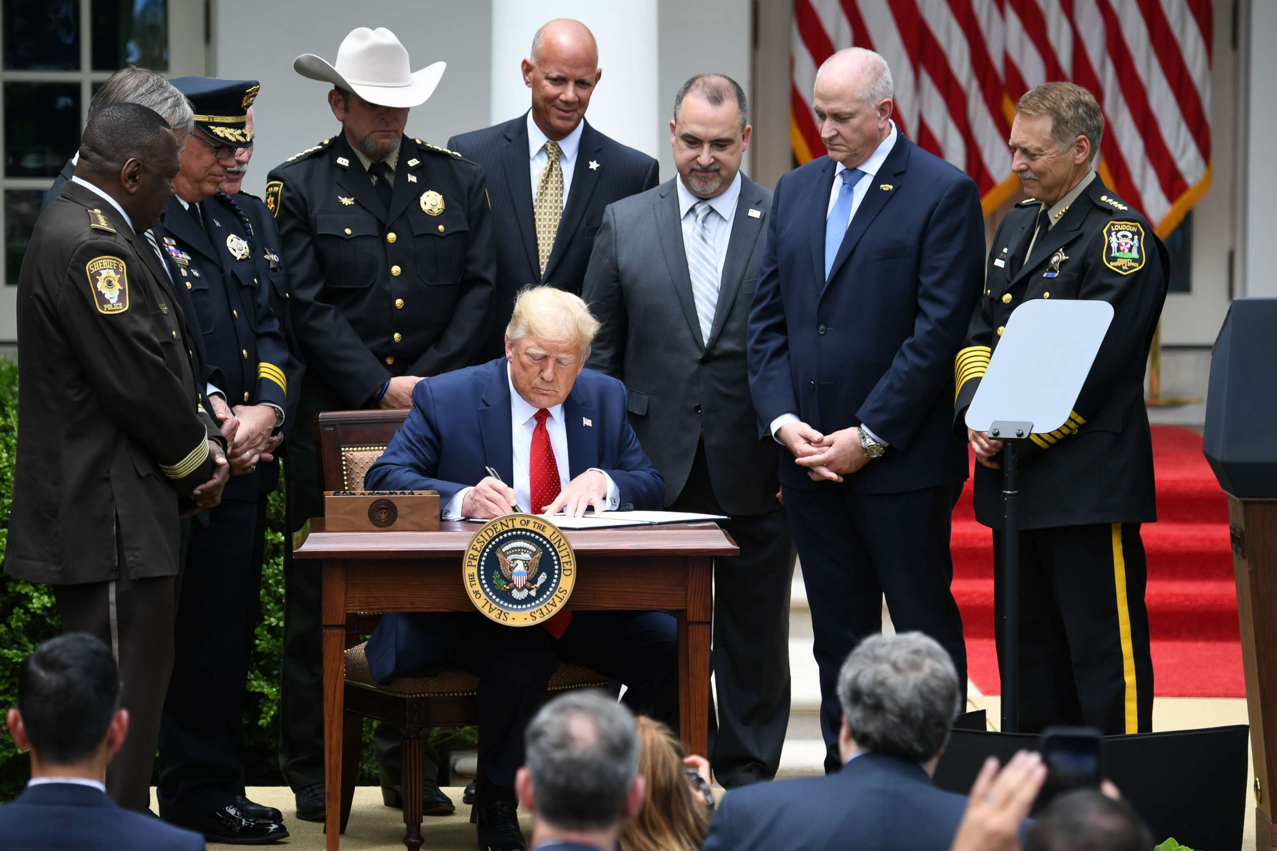 PHOTO: President Donald Trump signs an Executive Order on Safe Policing for Safe Communities, in the Rose Garden of the White House in Washington, June 16, 2020.