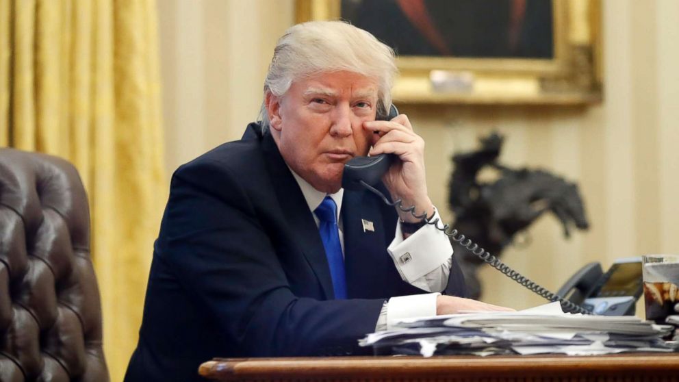President Donald Trump speaks on the phone with Prime Minister of Australia Malcolm Turnbull in the Oval Office of the White House, Jan. 28, 2017.