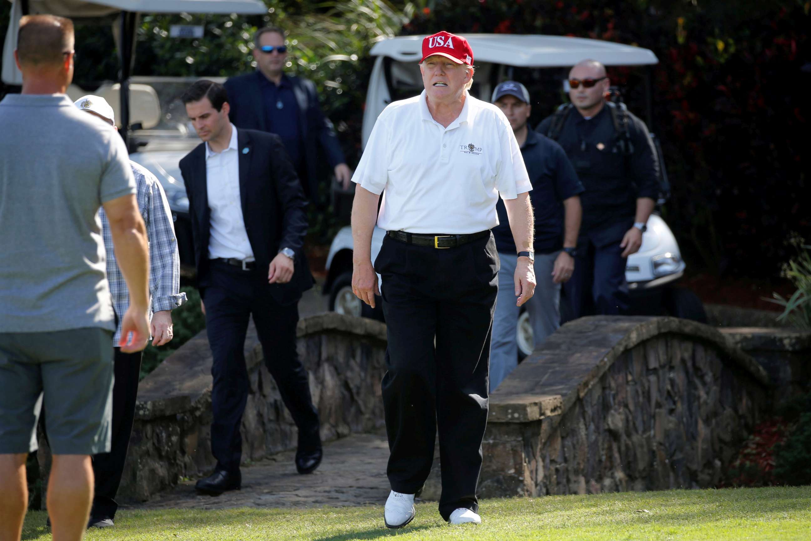 PHOTO: President Donald Trump arrives to play host to members of the U.S. Coast Guard he invited to play golf in West Palm Beach, Florida, Dec. 29, 2017.