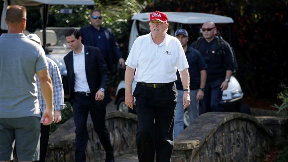 President Donald Trump arrives to play host to members of the U.S. Coast Guard he invited to play golf in West Palm Beach, Fla., Dec. 29, 2017.