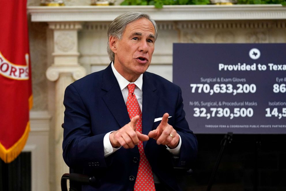 PHOTO: Texas Gov. Greg Abbott speaks with President Donald Trump during a meeting about the coronavirus response in the Oval Office of the White House, May 7, 2020, in Washington.