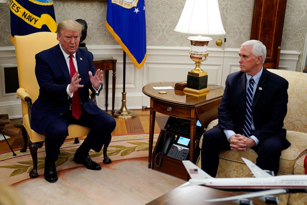 PHOTO: President Donald Trump speaks while Vice President Mike Pence listens during a meeting about the coronavirus response with Texas Gov. Greg Abbott in the Oval Office of the White House, May 7, 2020, in Washington.