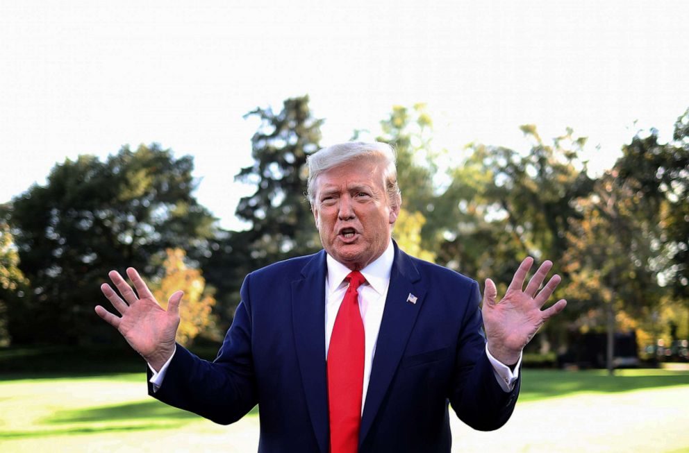 PHOTO: President Donald Trump answers questions before boarding Marine One while departing the White House, Oct. 10, 2019, in Washington, DC.