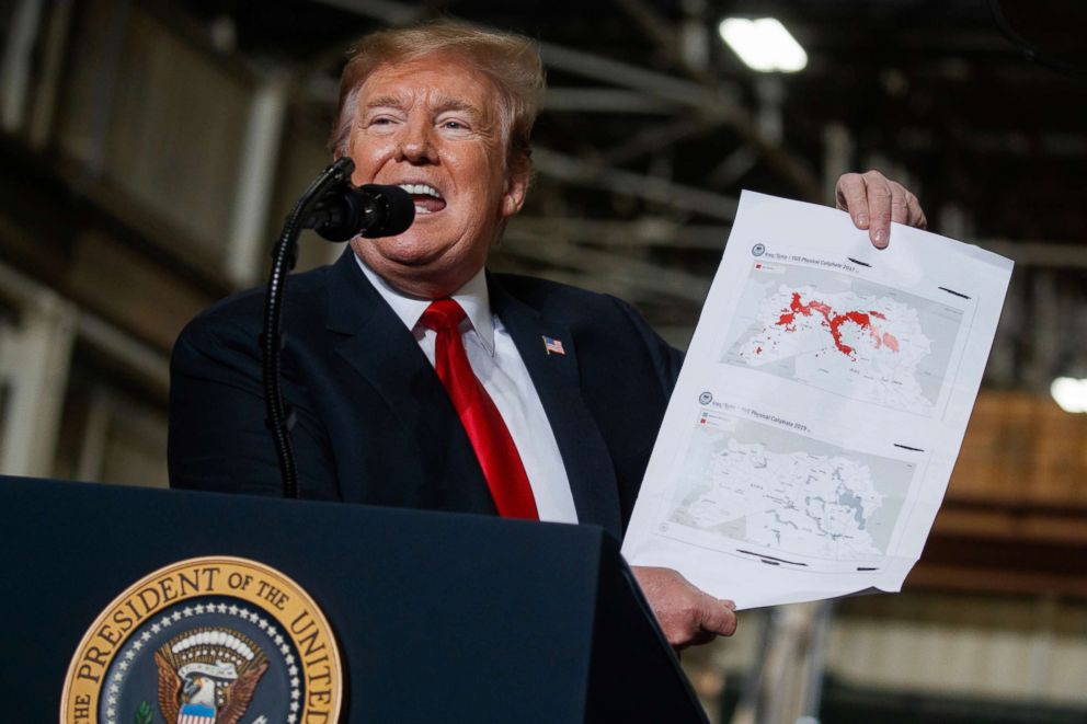 PHOTO: President Donald Trump holds up a chart documenting ISIS land loss in Iraq and Syria as delivers remarks at the Lima Army Tank Plant, March 20, 2019, in Lima, Ohio.
