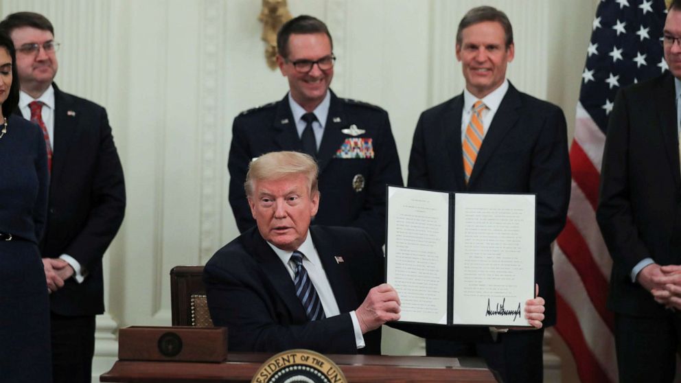 PHOTO: President Donald Trump holds up a presidential proclamation declaring an "Older Americans Month 2020" during an event about senior citizens and the coronavirus disease (COVID-19) pandemic in Washington, April 30, 2020. 