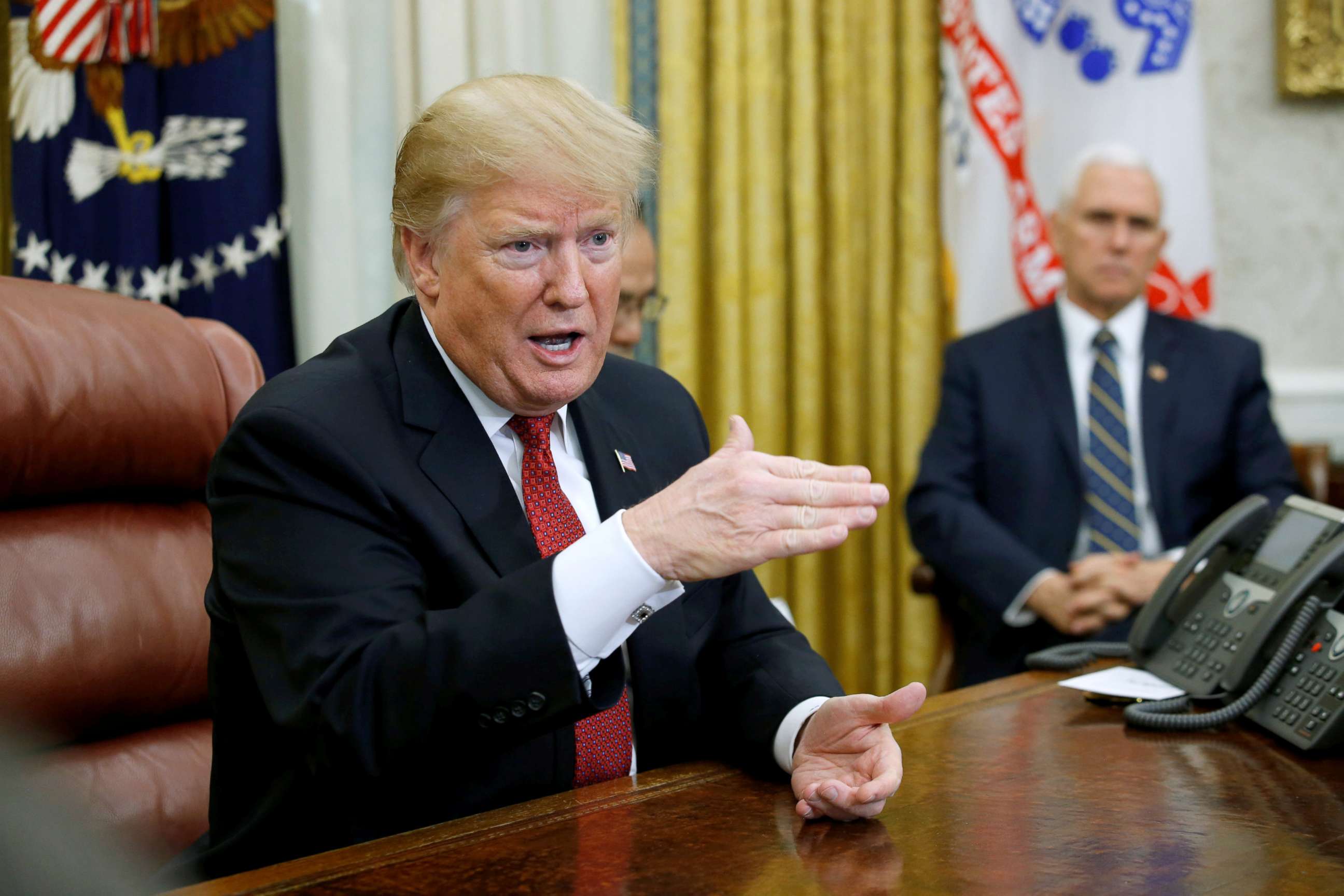PHOTO: President Donald Trump speaks to China's Vice Premier Liu He as Vice President Mike Pence looks on during a meeting in the Oval Office of the White House in Washington, Jan. 31, 2019.